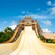 Enormous water slides that originate at a Mayan temple themed tower